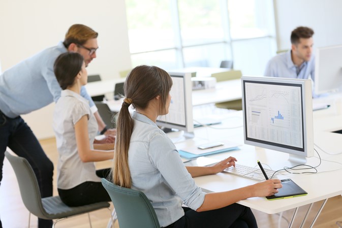 Productive team in an office working on their tasks