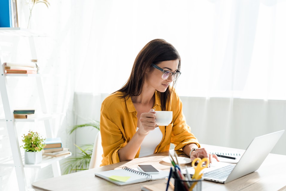 Woman working with laptop verifying a deleted user account