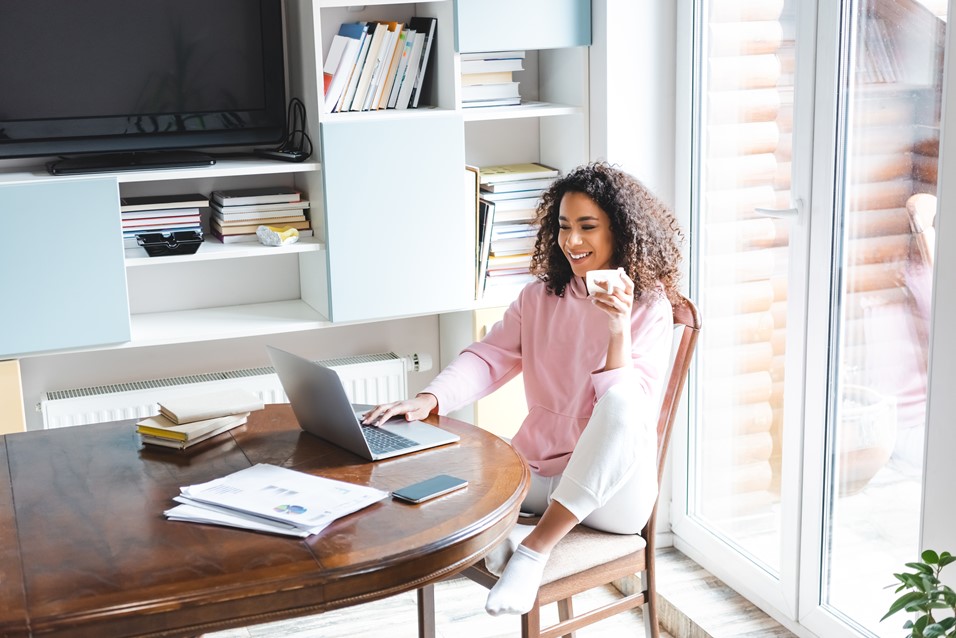 Woman with a laptop accessing OfficeSeries to reset her password